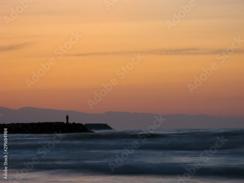  Sunset sky abstract background. Yellow sunset sky over the sea. Golden time of sky at sunset - sunrise time in summer season. Warm color sky  yellow. White space for text.