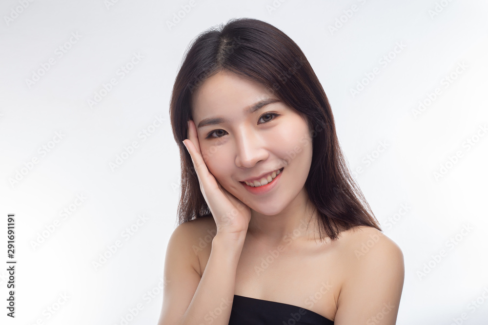 The woman wore a black strapless dress and hands touch her face. The woman wore a black strapless dress and hands touch her face.