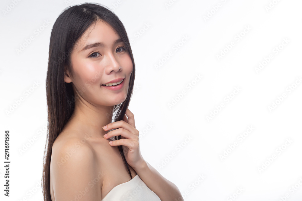 The women wear white strapless tops and face to the right. The women wear white strapless tops and face to the right.