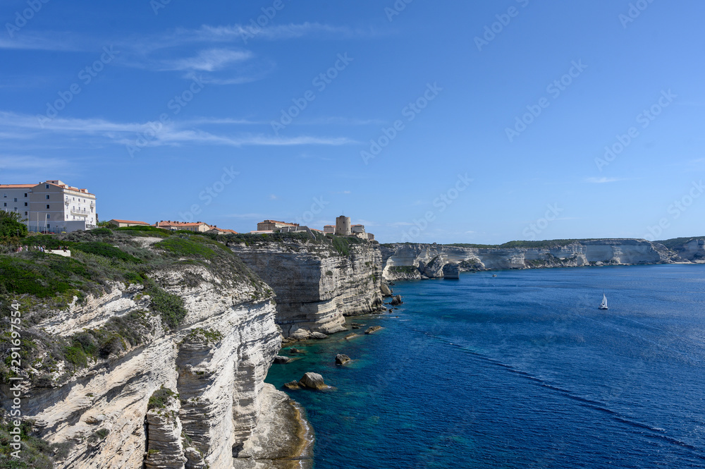 Panoramic view of the white limestone cliffs and Bonifacio Corsica. Sea and blue sky