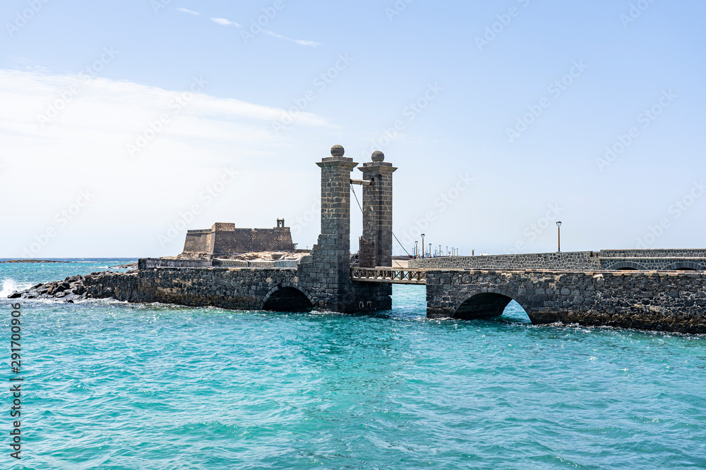 An old access road, with a bridge and a gateway, leads to the old fortress (Castillo de San Gabriel), Arrecife, Lanzarote, Spain