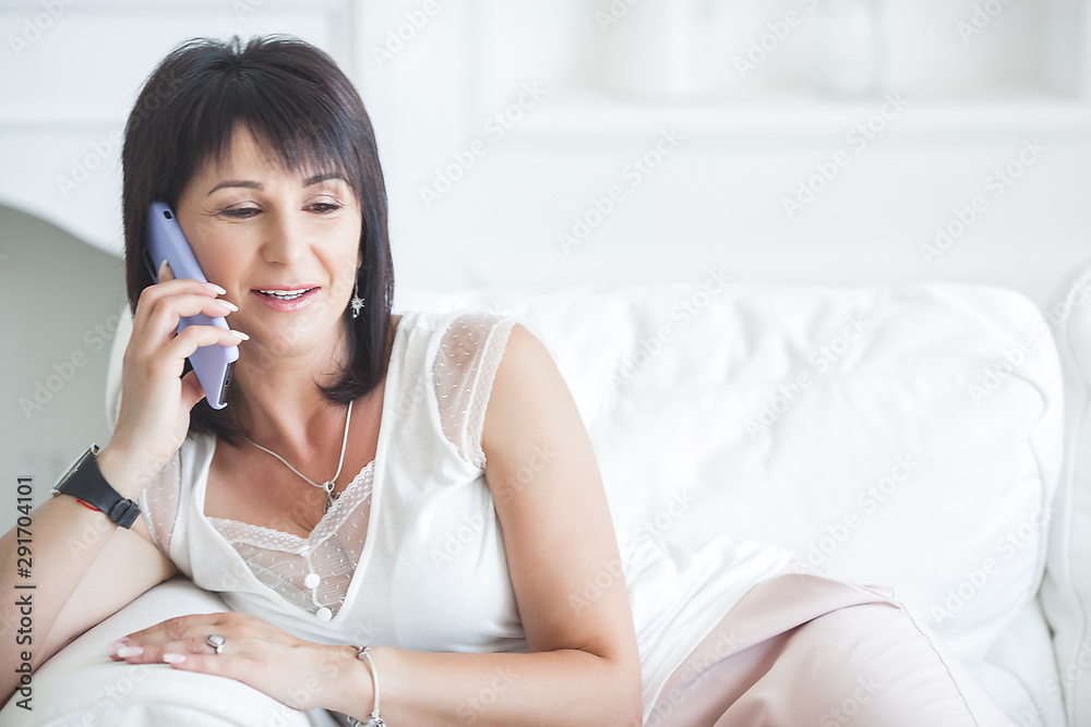 Adult woman interior portrait. Mature female indoors. Cheerful woman closeup portrait. Lady at home.