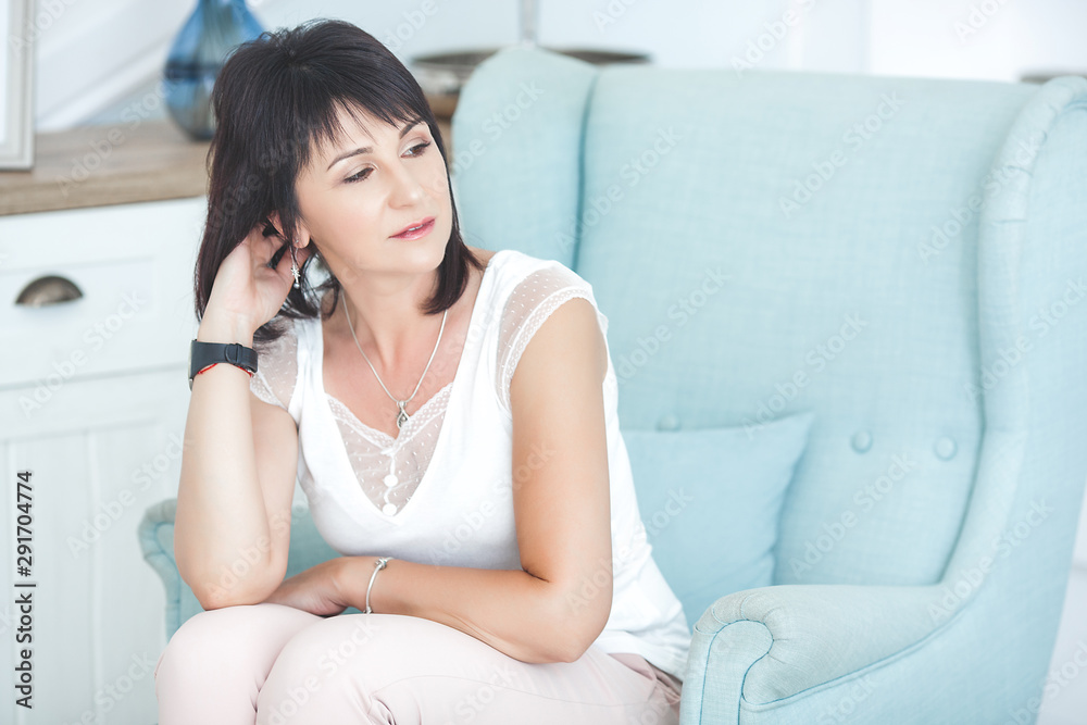 Adult woman interior portrait. Mature female indoors. Cheerful woman closeup portrait. Lady at home. Adult woman interior portrait. Mature female indoors. Cheerful woman closeup portrait. Lady at home.