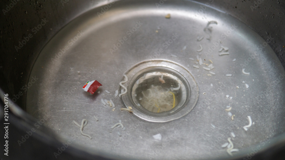 Clogged sink with food leftover. Uncleaned kitchen sink with dirty food leftover. Clogged sink with food leftover. Uncleaned kitchen sink with dirty food leftover.