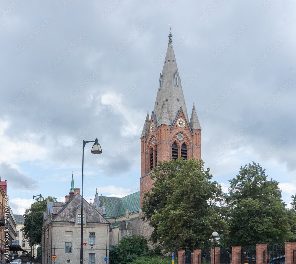 Red brick St. Nikolai church and old building. Orebro town. Background or illustration. Travel photo.