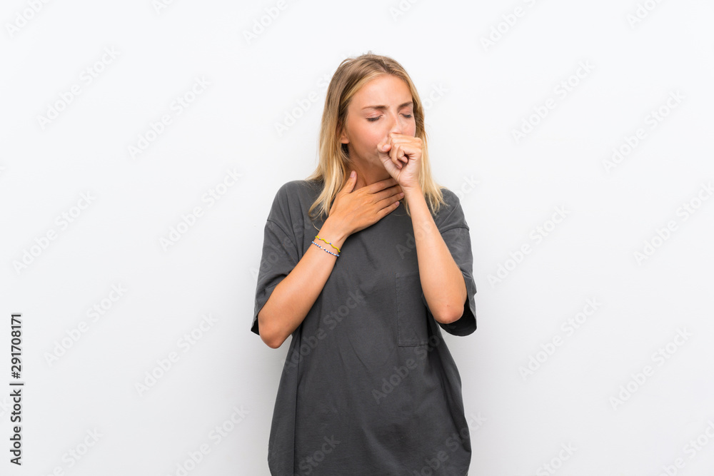 Blonde young woman over isolated white background is suffering with cough and feeling bad Blonde young woman over isolated white background is suffering with cough and feeling bad