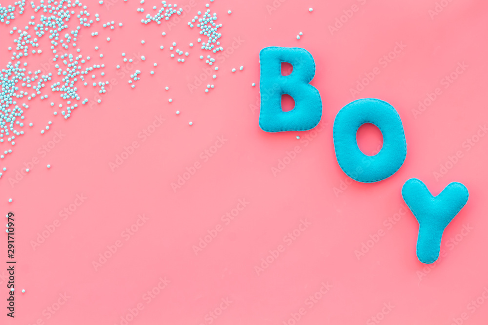 Boy word as decoration for baby shower on pink background top view frame copy space Boy word as decoration for baby shower on pink background top view frame copy space