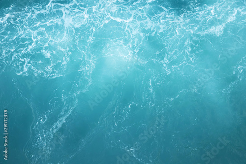 Sea Waves in ocean wave Splashing Ripple Water. Blue water background. Leave space to write descriptive text.