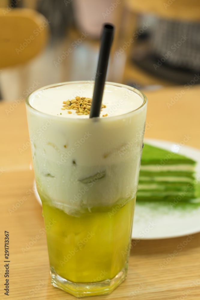 Tasty matcha cake with cold tea for dessert in a Korean restaurant. Tasty matcha cake with cold tea for dessert in a Korean restaurant.