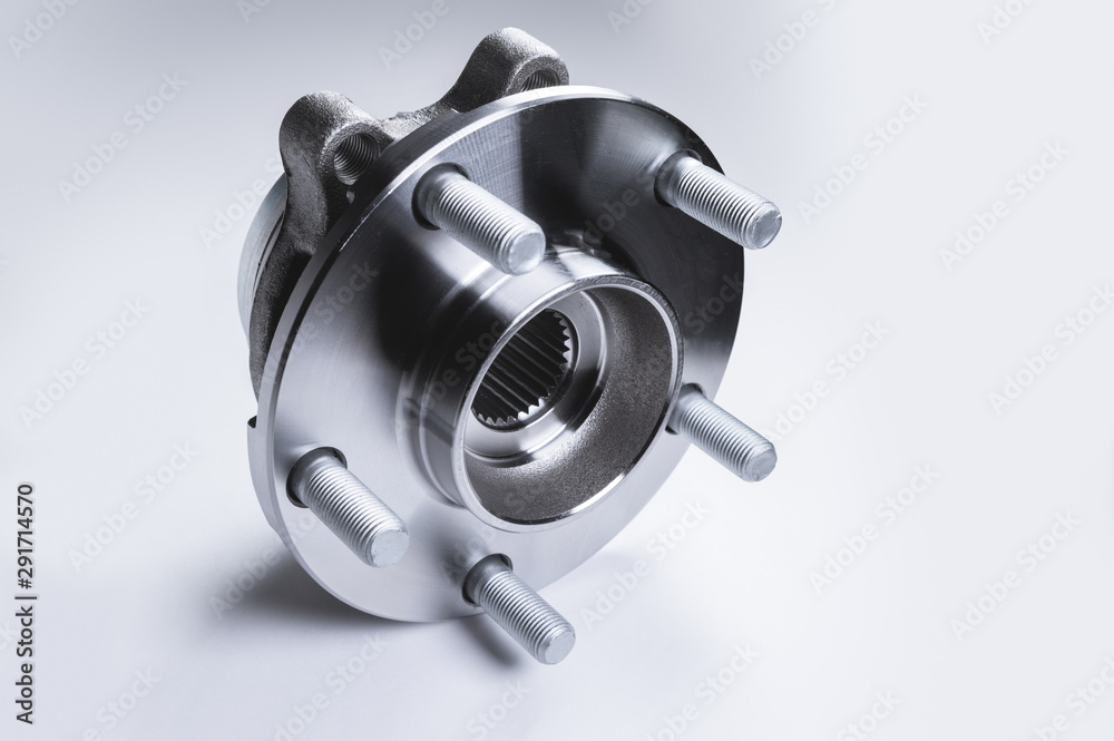 New Wheel hub assembly with bearing. This is part of the car suspension on a gray background with a gradient. The concept of new car parts New Wheel hub assembly with bearing. This is part of the car suspension on a gray background with a gradient. The concept of new car parts