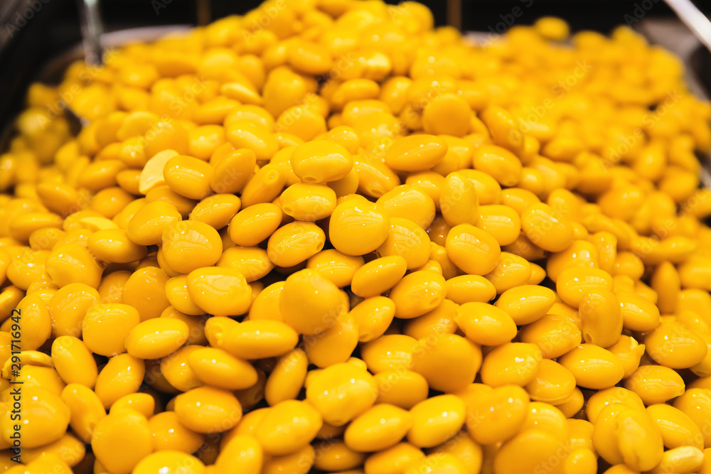 Cooked yellow lupinus albus beans at the market. Food to go. Tasty take away snack suitable for vegeterians and vegans Cooked yellow lupinus albus beans at the market. Food to go. Tasty take away snack suitable for vegeterians and vegans