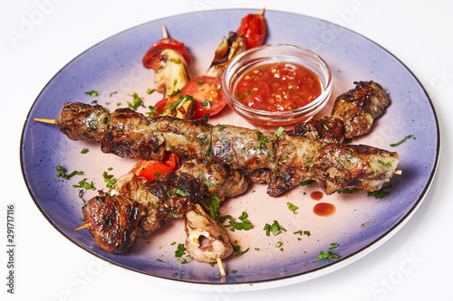 Kebab with garnish and sauce