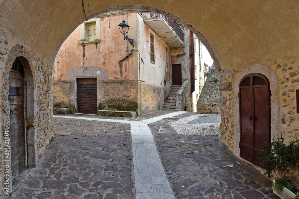 A street among the old houses of a medieval village A street among the old houses of a medieval village