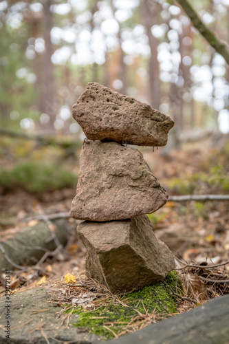 Tower of 3 stacked sandstones on the forest floor