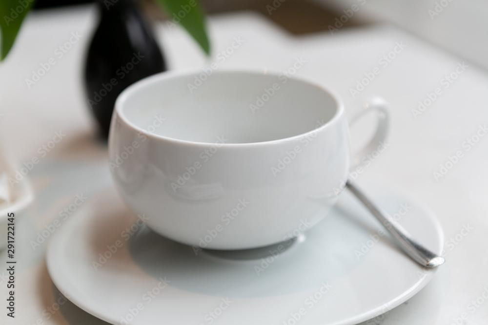 White empty tea cup in restaurant 