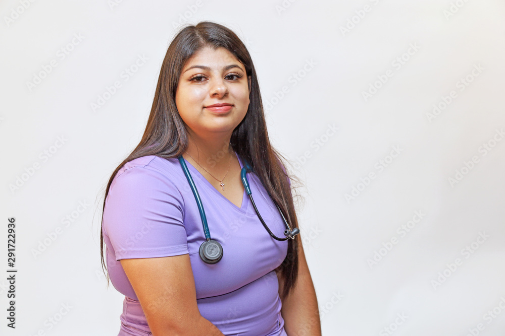 Portrait of a young attractive female hispanic healthcare professional, woman nurse Portrait of a young attractive female hispanic healthcare professional, woman nurse