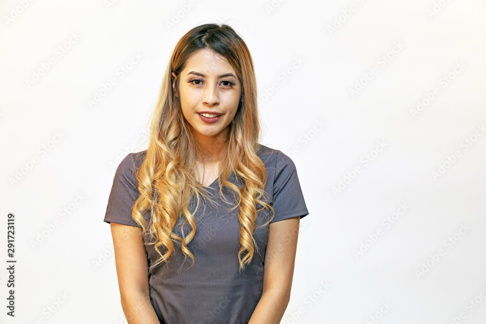 Portrait of a young attractive hispanic healthcare professional on white background with copy space Portrait of a young attractive hispanic healthcare professional on white background with copy space