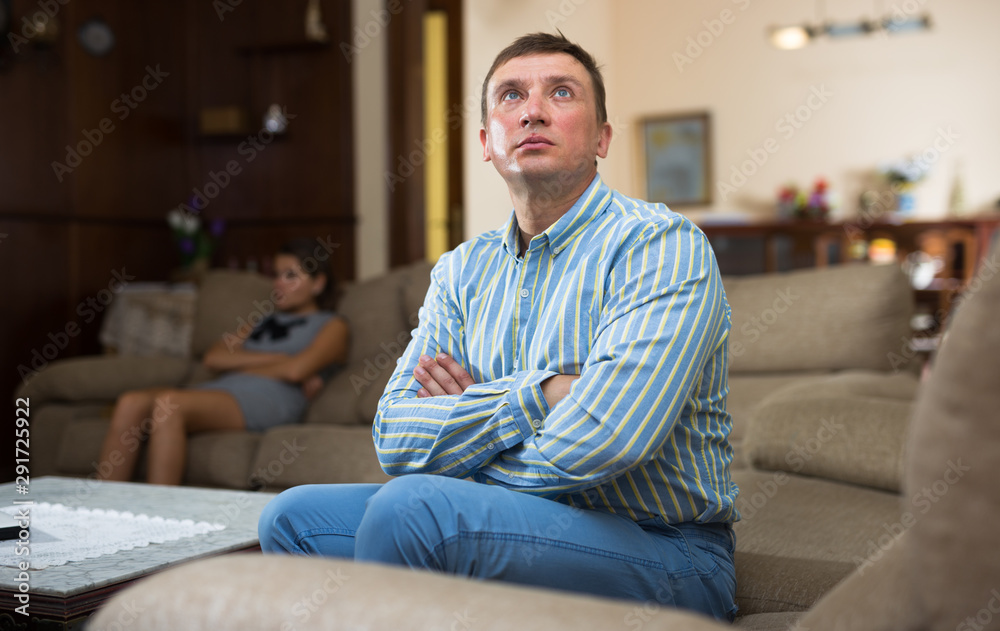 Fototapeta premium Man and his wife after quarrel