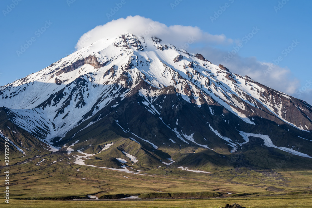 Beautiful autumn volcanic landscape - view of snow-capped cone of ...