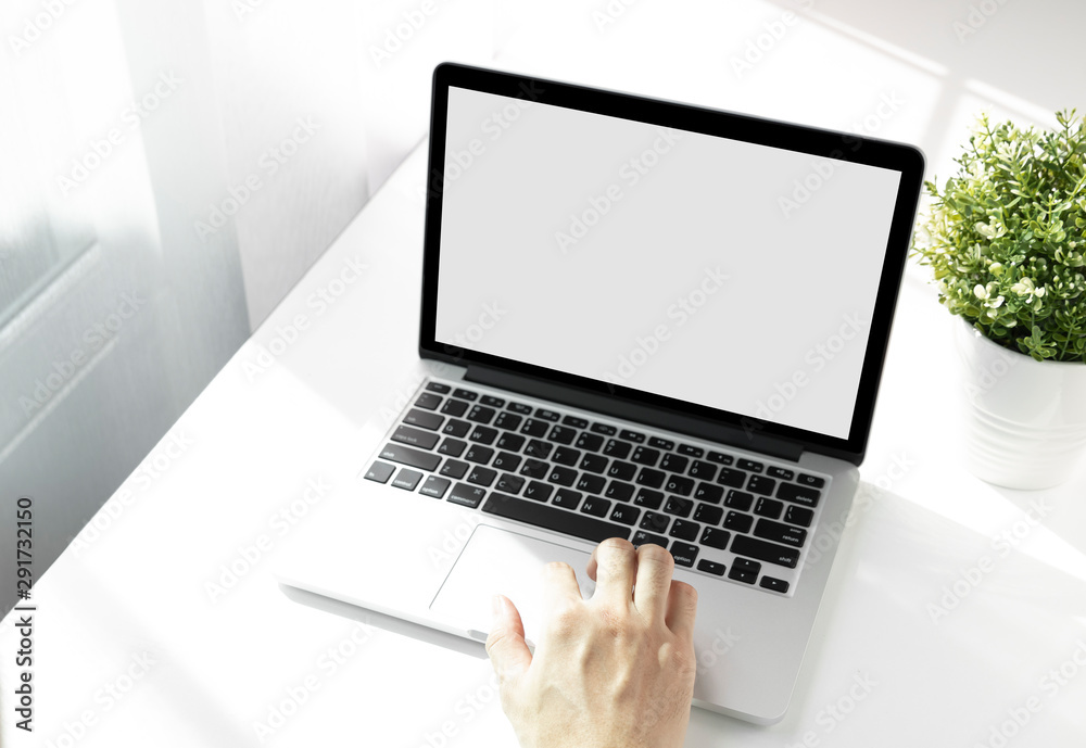 Fototapeta premium Mockup image of a man working at the laptop