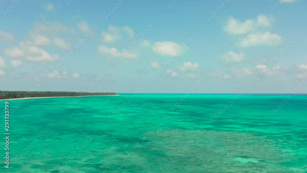 Coral reefs and atolls in the tropical sea, top view. Turquoise sea water and beautiful shallows. Philippine nature. Coral reefs and atolls in the tropical sea, top view. Turquoise sea water and beautiful shallows. Philippine nature.