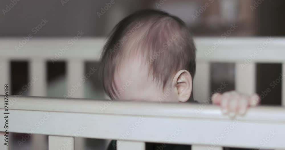 Baby boy in a crib Baby boy in a crib