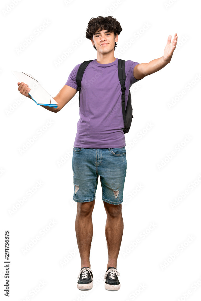 A full-length shot of a Young student man presenting and inviting to come with hand over isolated white background A full-length shot of a Young student man presenting and inviting to come with hand over isolated white background
