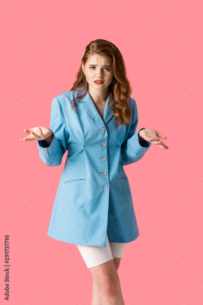 upset girl looking at camera while showing shrug gesture isolated on pink upset girl looking at camera while showing shrug gesture isolated on pink