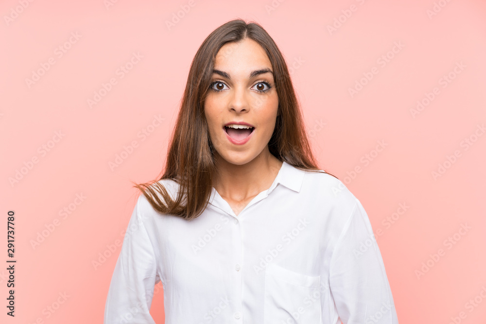 Young woman over isolated pink background with surprise facial expression