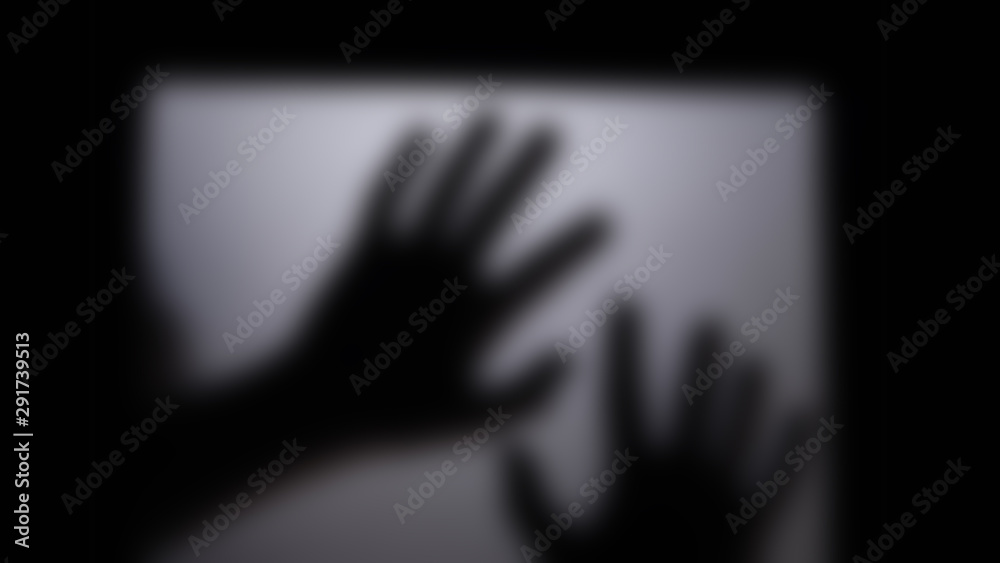 Shadow hand behind the door mirror. Shadow hand behind the door mirror.