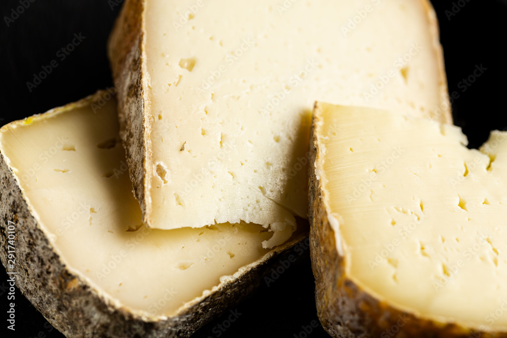 Variety of hard cheese on black background Variety of hard cheese on black background