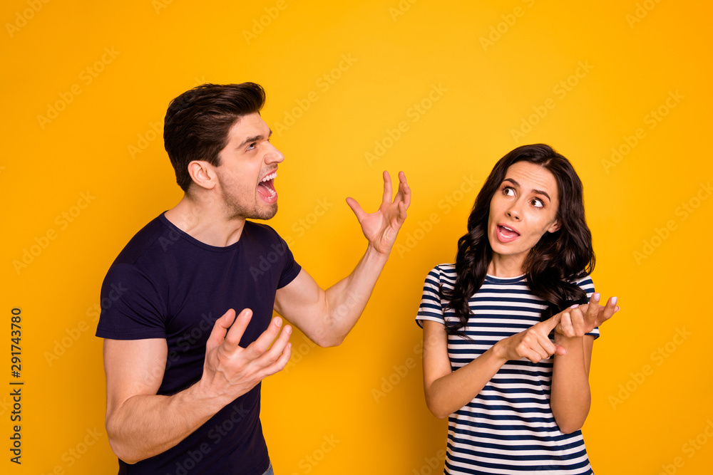 Portrait of nice attractive irritated annoyed aggressive sullen gloomy grumpy people expressing anger pretense argument scolding marriage fail failure isolated on bright vivid shine yellow background Portrait of nice attractive irritated annoyed aggressive sullen gloomy grumpy people expressing anger pretense argument scolding marriage fail failure isolated on bright vivid shine yellow background