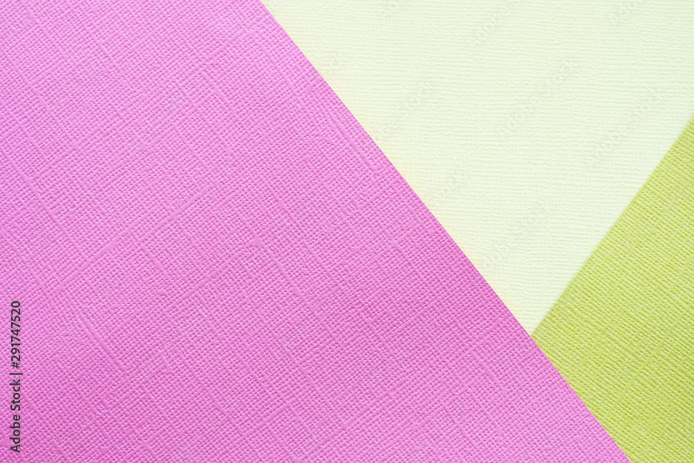 Abstract background and texture. Three multi-colored sheets of texture paper in pink, light yellow and yellow green.. Abstract background and texture. Three multi-colored sheets of texture paper in pink, light yellow and yellow green..
