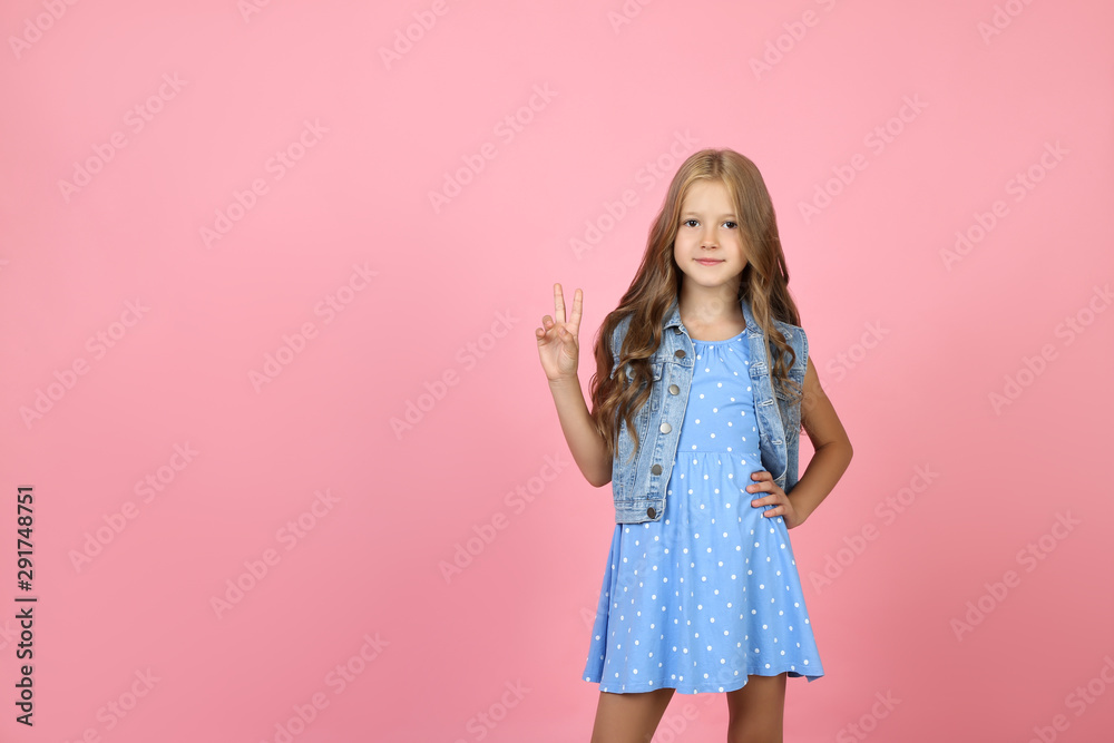 Pretty little girl on pink background Pretty little girl on pink background