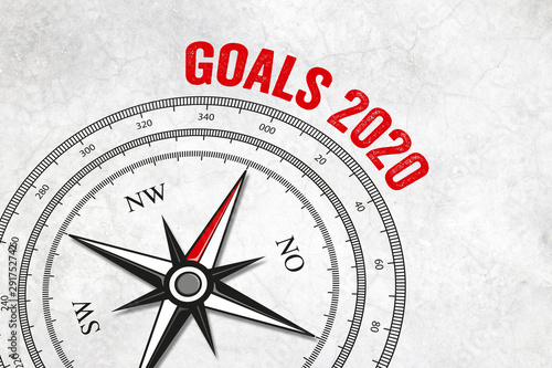 Compass with compass needle and goals 2020 on marble background