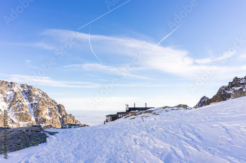 Slovak High Tatras in winter. Mountain shelter ( Teryho Chata ) in the background. photo