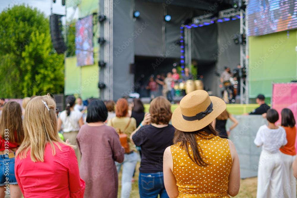 Couple is watching concert at open air music festival Couple is watching concert at open air music festival