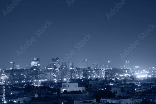 Night view of the city life. Light of the buildings shining with cool blue tones. View of night scene of Tel Aviv, Israel. Blue tone city scape. © polack