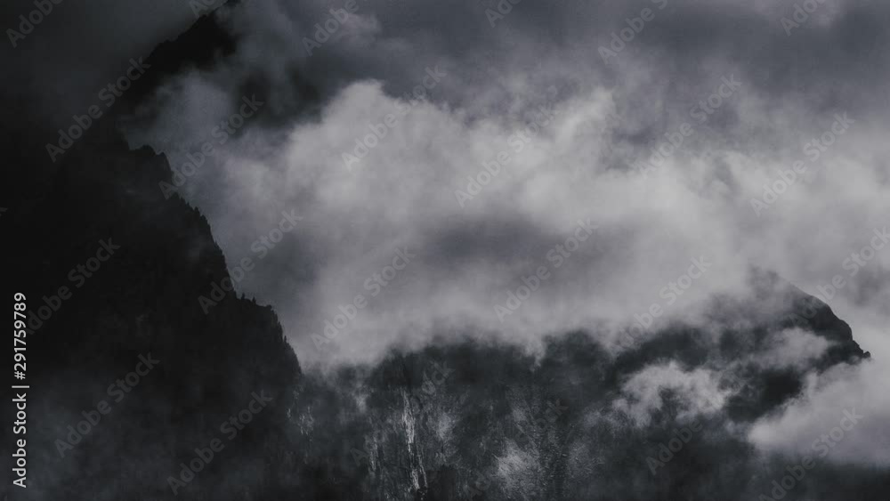 Clouds over rural landscape, black and white background Clouds over rural landscape, black and white background