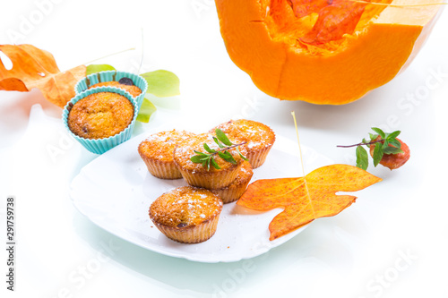 baked sweet pumpkin muffins with dried apricots inside
