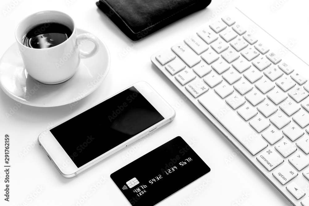 credit card, keyboard, smartphone and coffee cup on white background credit card, keyboard, smartphone and coffee cup on white background