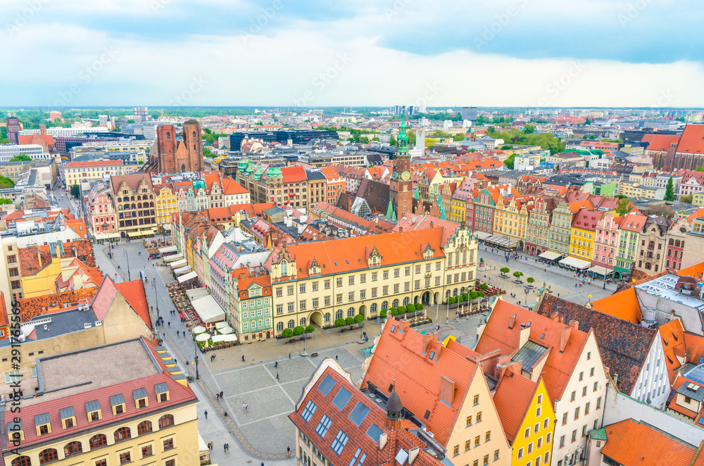 Top aerial panoramic view of Wroclaw old town historical city centre with Rynek Market Square, Old Town Hall, New City Hall, colorful buildings with multicolored facade and tiled roofs, Poland