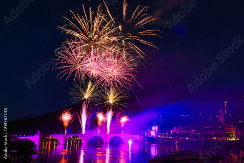Colored fireworks over the river