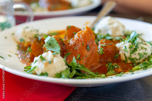 Eating vegetable pumpkin goulash in a austrian or german restaurant