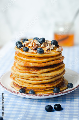 fluffy pancakes with honey and berries