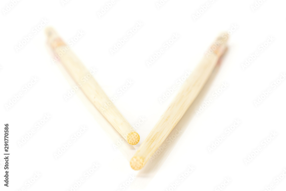 Group of two whole asian brown chopsticks isolated on white background Group of two whole asian brown chopsticks isolated on white background