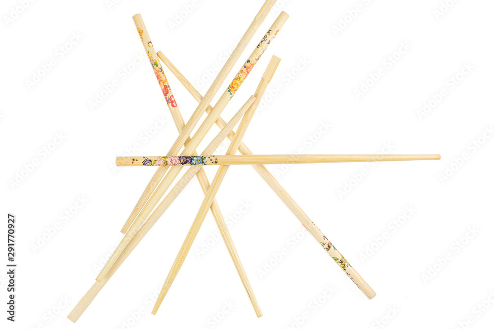 Lot of whole colorful asian brown chopsticks flatlay isolated on white background