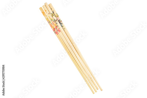 Group of four whole colorful asian brown chopsticks flatlay isolated on white background