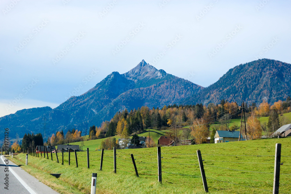 View from a car window to the rural alpine landscape