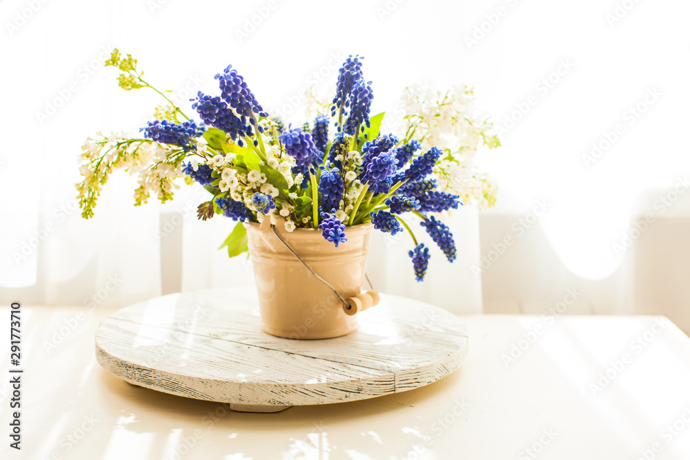 Bunch of grape hyacinths in a ceramic vase Bunch of grape hyacinths in a ceramic vase